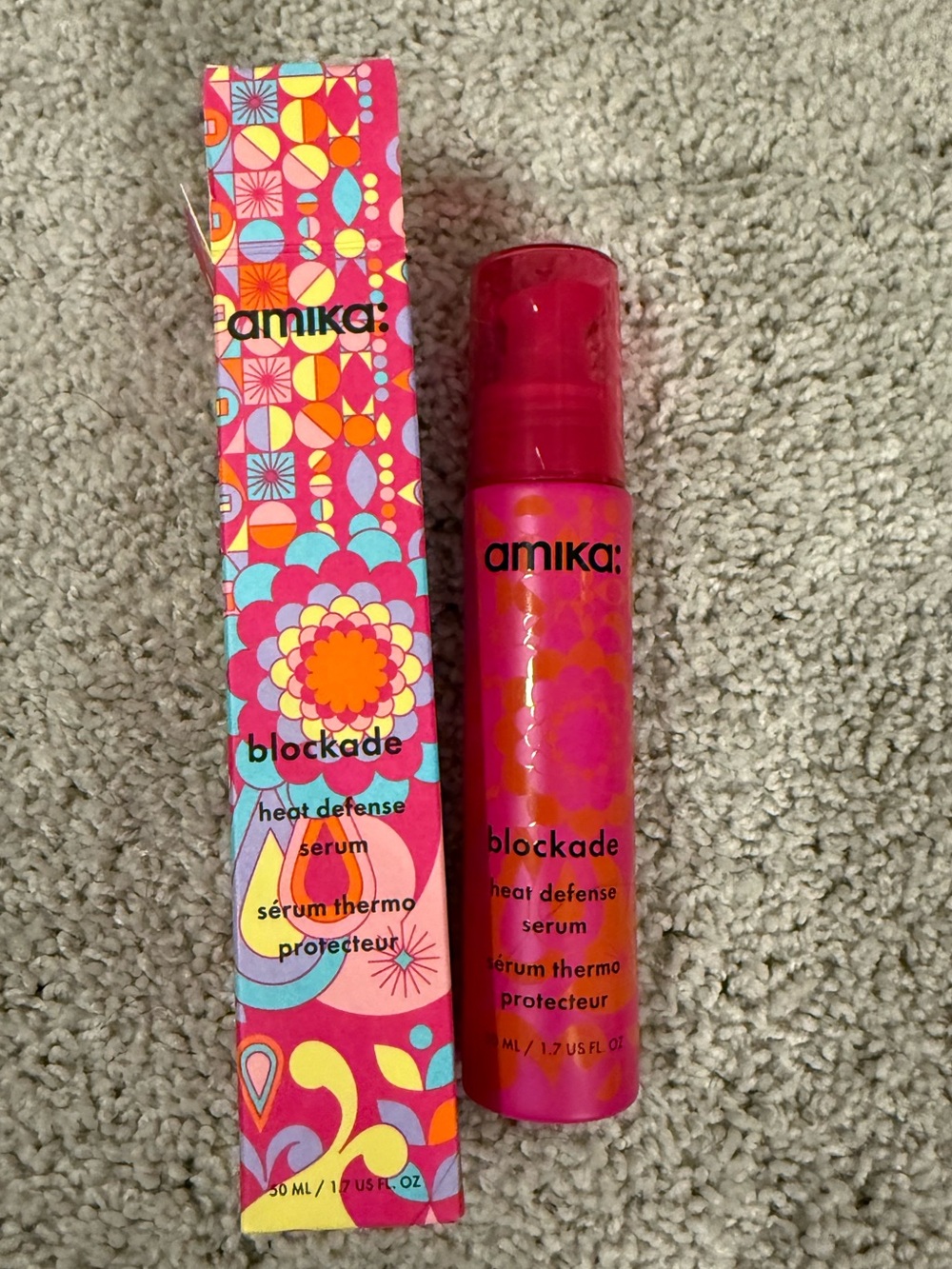 amika Blockade Heat Defense Serum — bright pink packaging